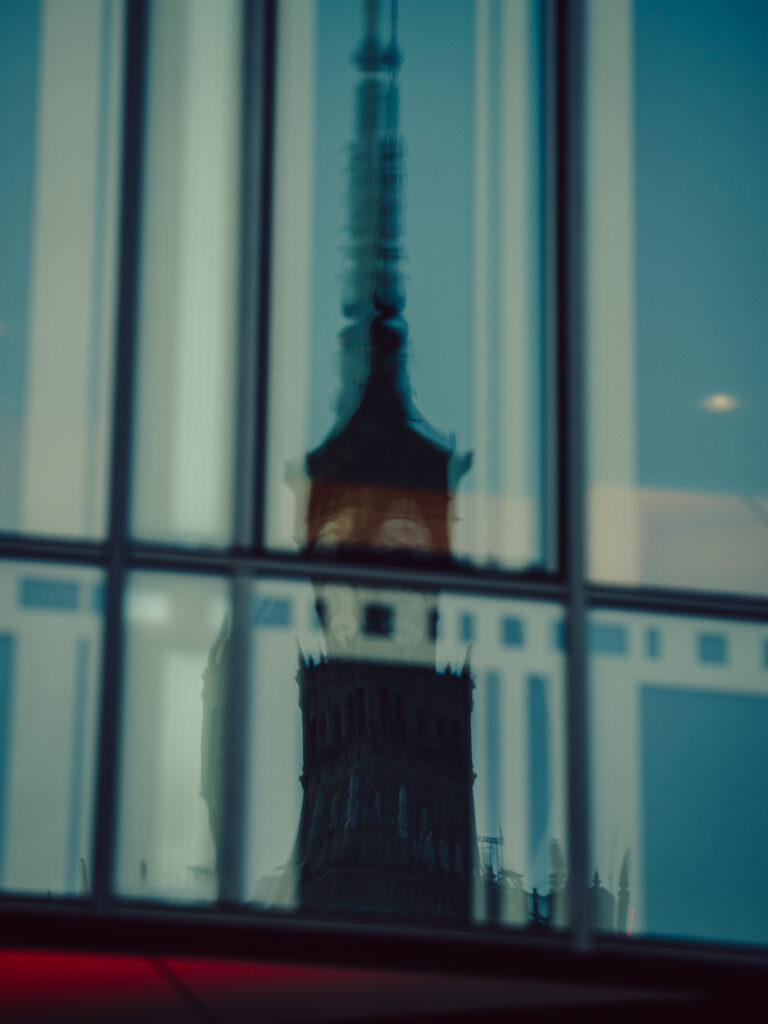 A photo of a reflection of the Palace of Culture and Science. 