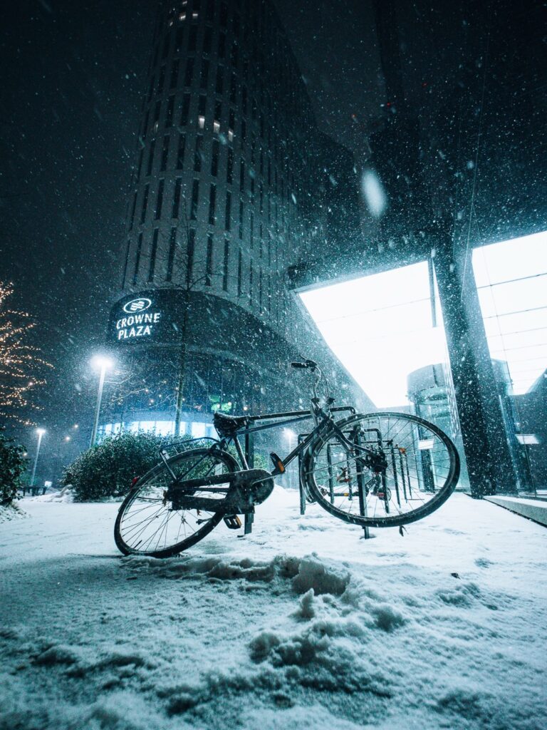 Futuristic and epic frame of a bike during snowstorm in Warsaw.