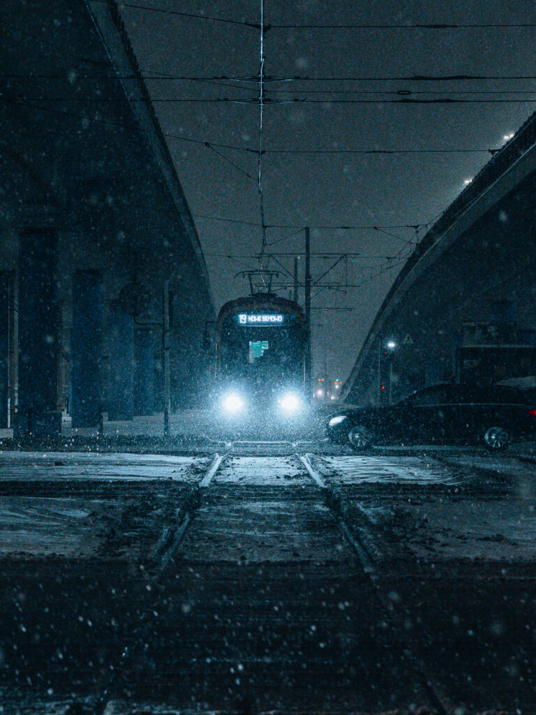 Dark tram photography taken with the SIGMA 20-200mm F3.5-6.3 lens.
