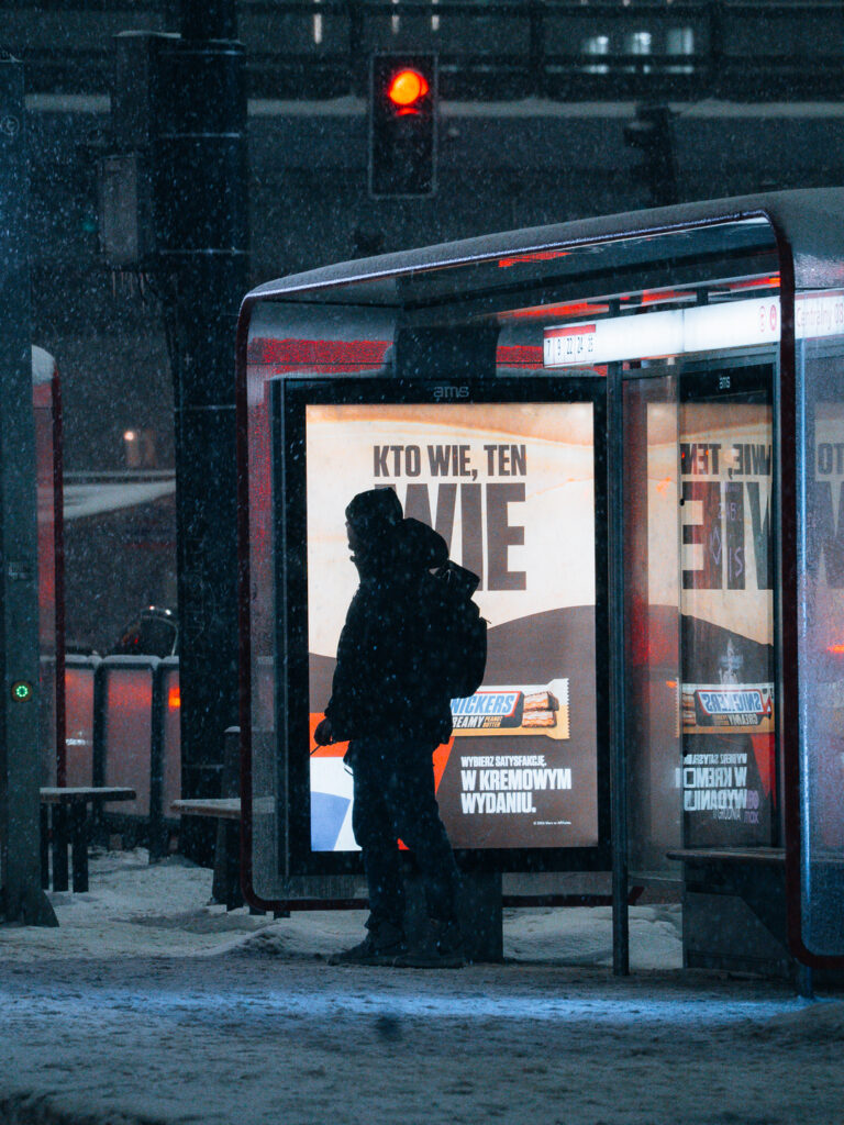 A guy's silhouette in front of a poster. 