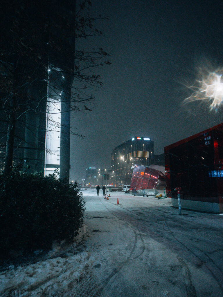 Two dark silhouettes walking in the center of the frame. Taken with AstrHori 9mm F2.8.