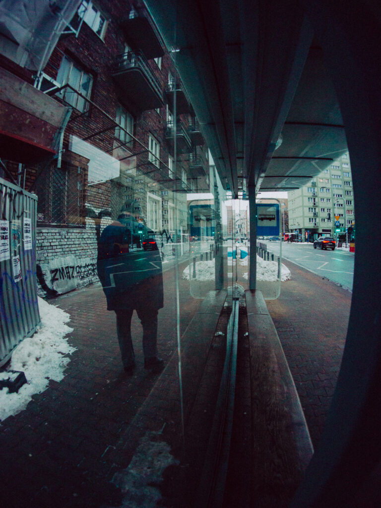 A through the window shot of a guy taken with the Sony A6000 in 2026.