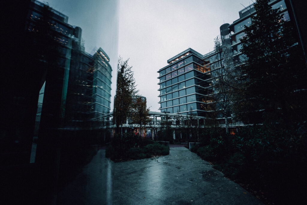 Office area with a window reflection on the left side.