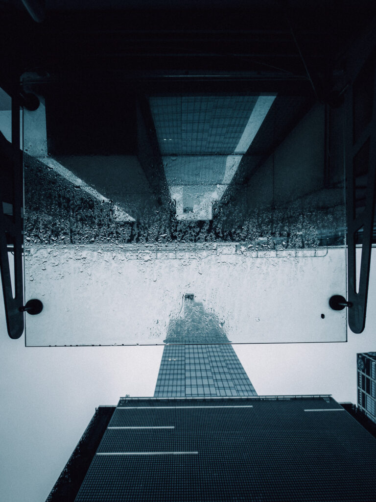 Lookup shot on the piece of glass and a skyscraper taken with the 7Artisans 10mm F2.8.