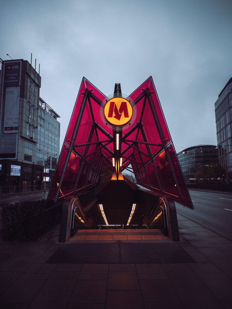 Warsaw metro entry with a classic M letter above the stairs. 