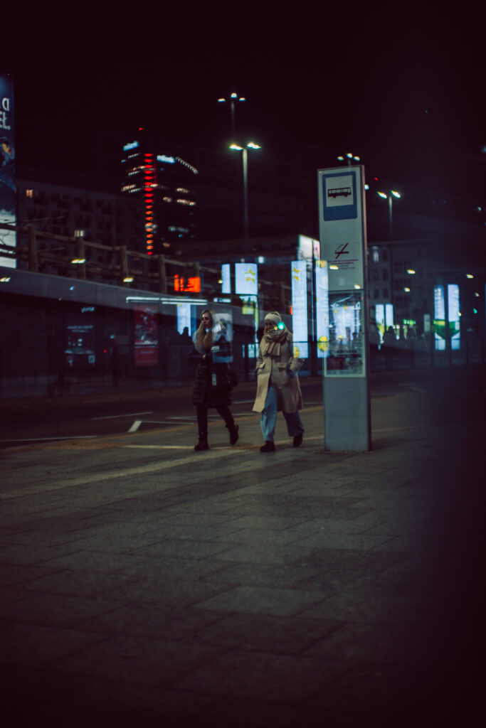Through a window shot with two silhouettes on the other side.