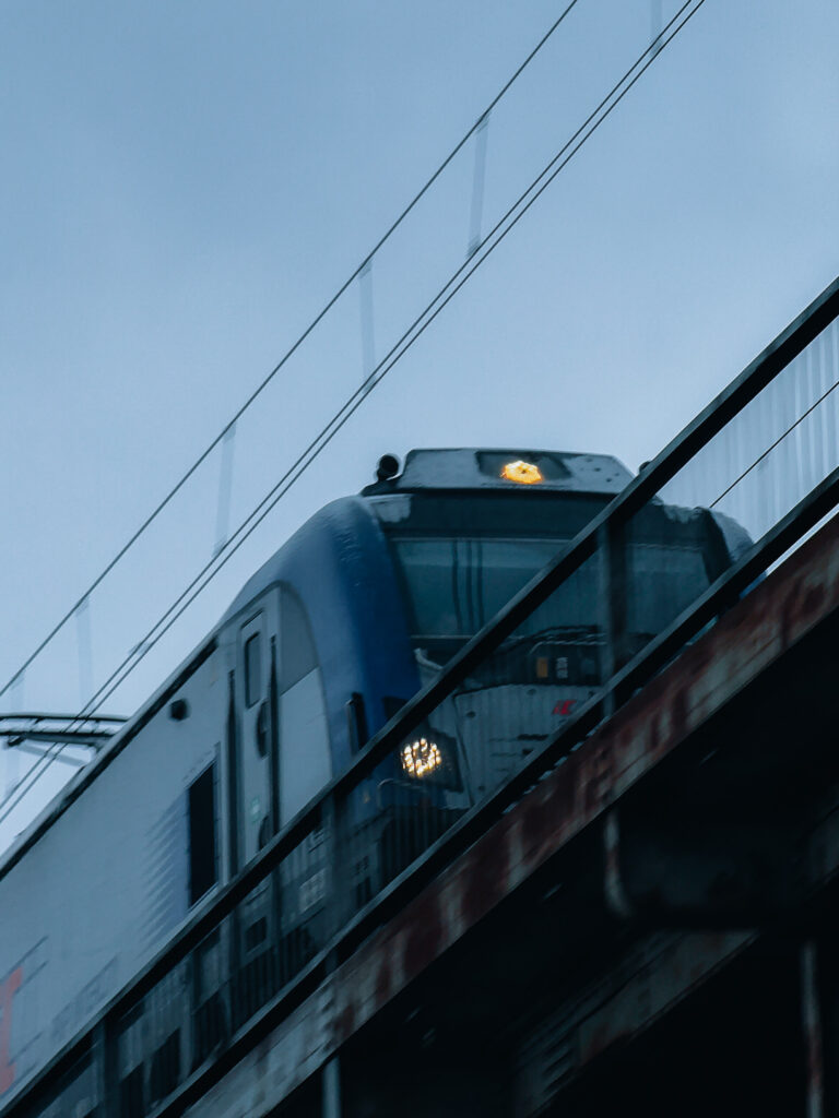 Train on a bridge taken with the SANDMARC Telephoto Tetraprism lens.