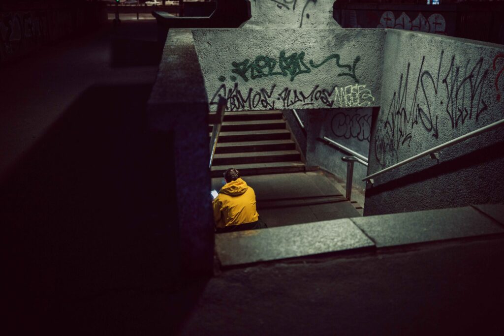 Chilling on the stairs. Not a perfect spot to do that. Taken with the Sigma 35mm F1.4 DG II lens.