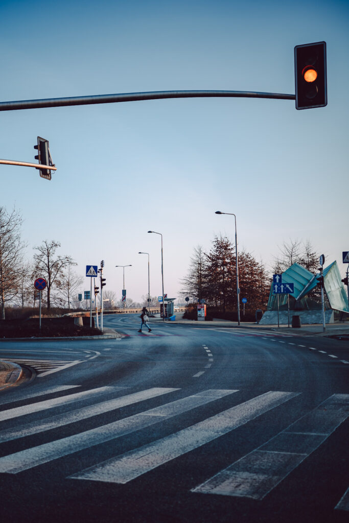 A person crossing the street. Taken with the 7Artisans 40mm F2.5 lens.