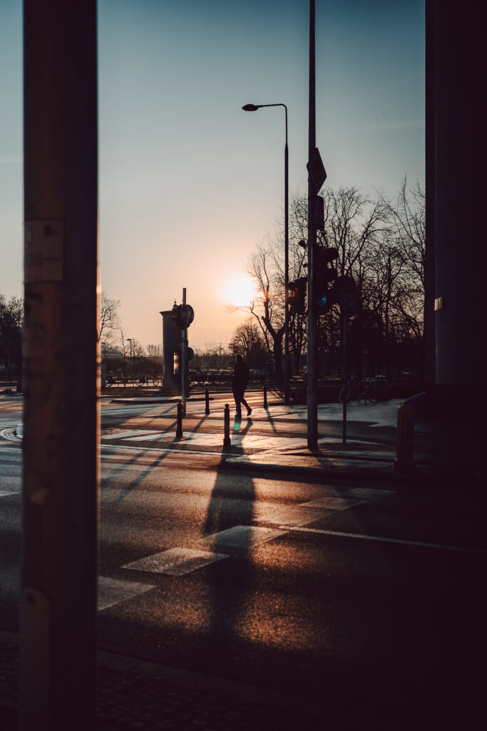Pedestrian on the street during sunrise taken with the 7Artisans 40mm F2.5 lens.