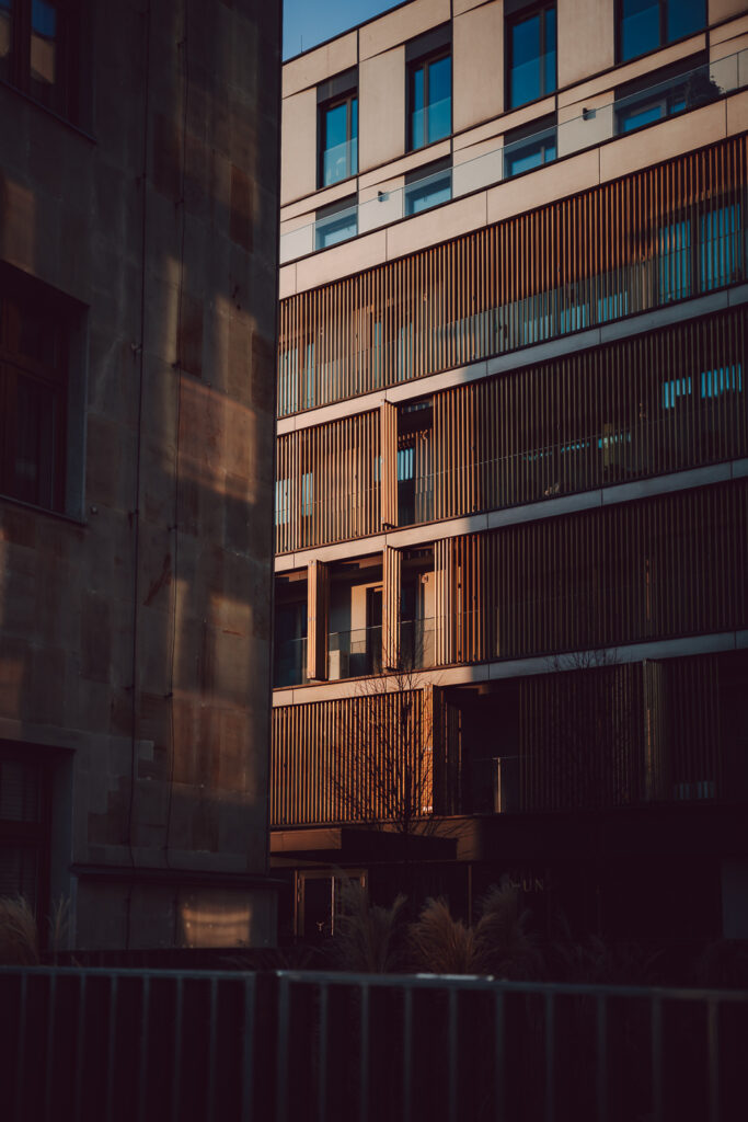 Tightly packed buildings illuminated by the sun's rays.