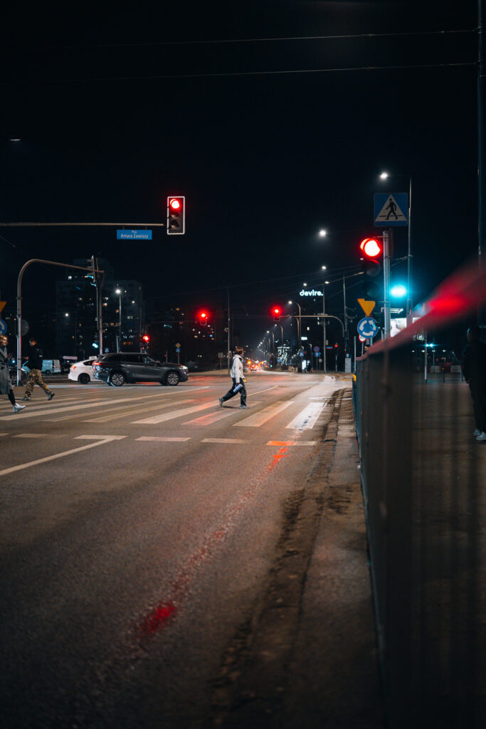 A pedestrian crossing the street.