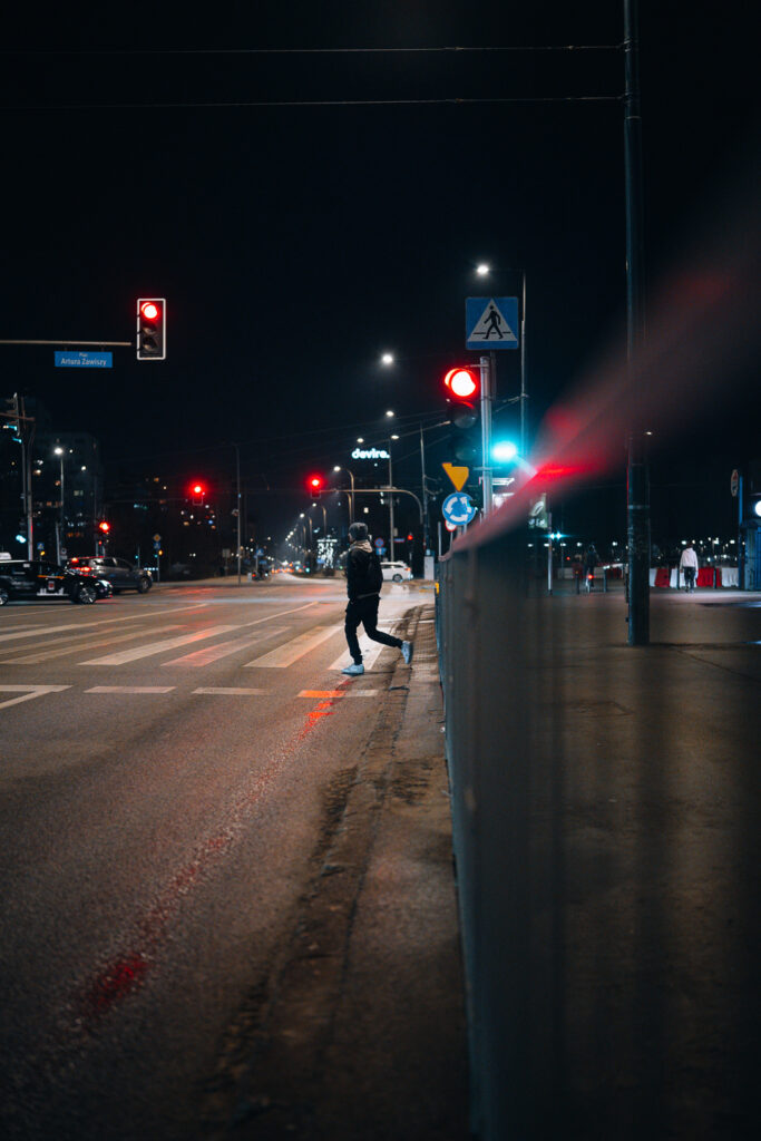 A pedestrian crossing the street.