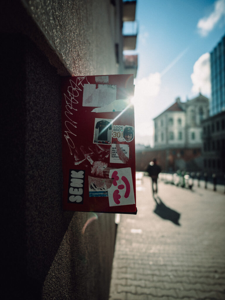 A box on the wall with a visible sun flare.