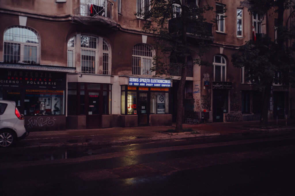 Rainy street with old school stores.