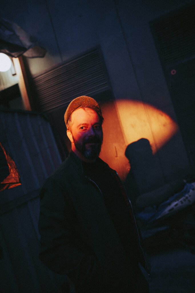 Just half of his face is lit with the SmallRig RF 20C light.